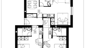 Un plan d’étage d’un hôtel comprenant plusieurs chambres, ainsi qu’un espace repas, une cuisine et des installations sanitaires.