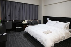 Habitación Deluxe | Caja fuerte, escritorio, cortinas opacas y sistema de insonorización