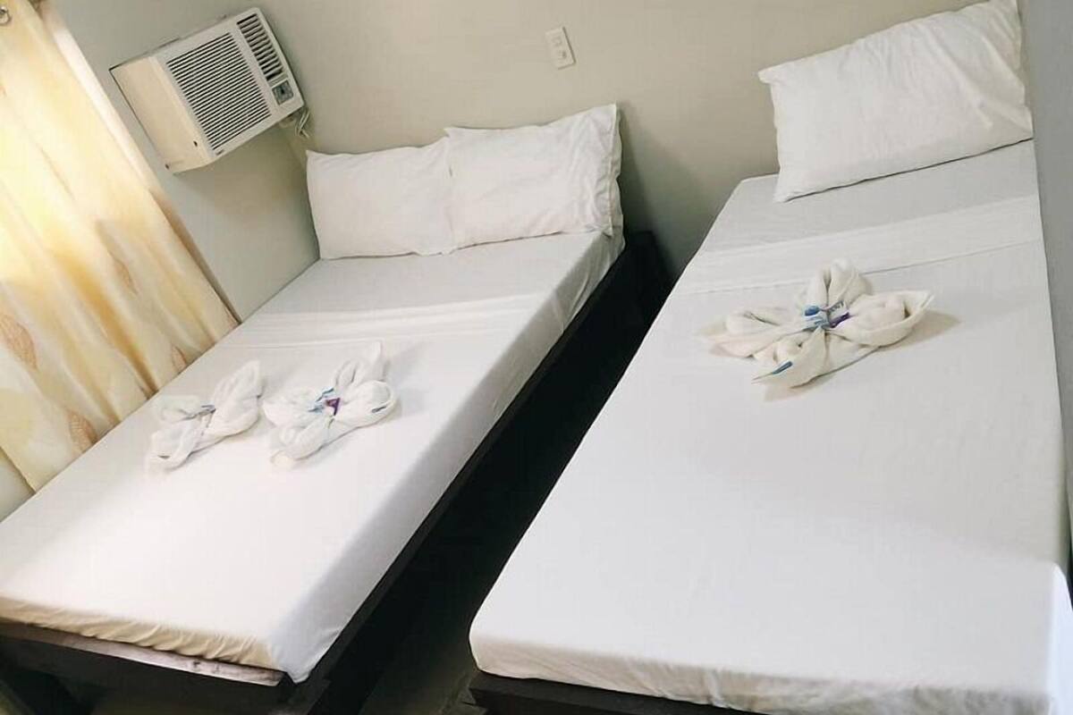 Habitación doble familiar, vista a la ciudad | Camas extra, wifi gratis y ropa de cama