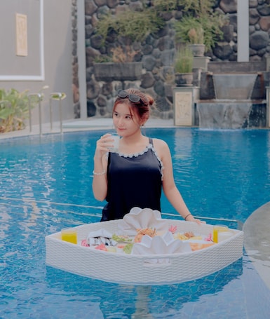 Outdoor pool. Front One Hotel Nganjuk
