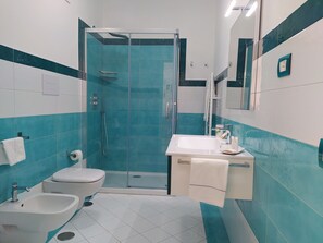 Combined shower/tub, jetted tub, hair dryer, bidet