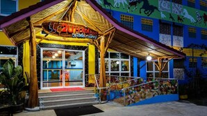 A colorful building with a sign reading "2U Hotel".