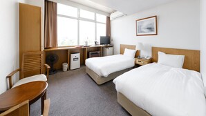 A hotel room with two beds, a desk, a chair, a TV, and a window with curtains. - Tabist THE GREEN ASAHIKAWA (Asahikawa)