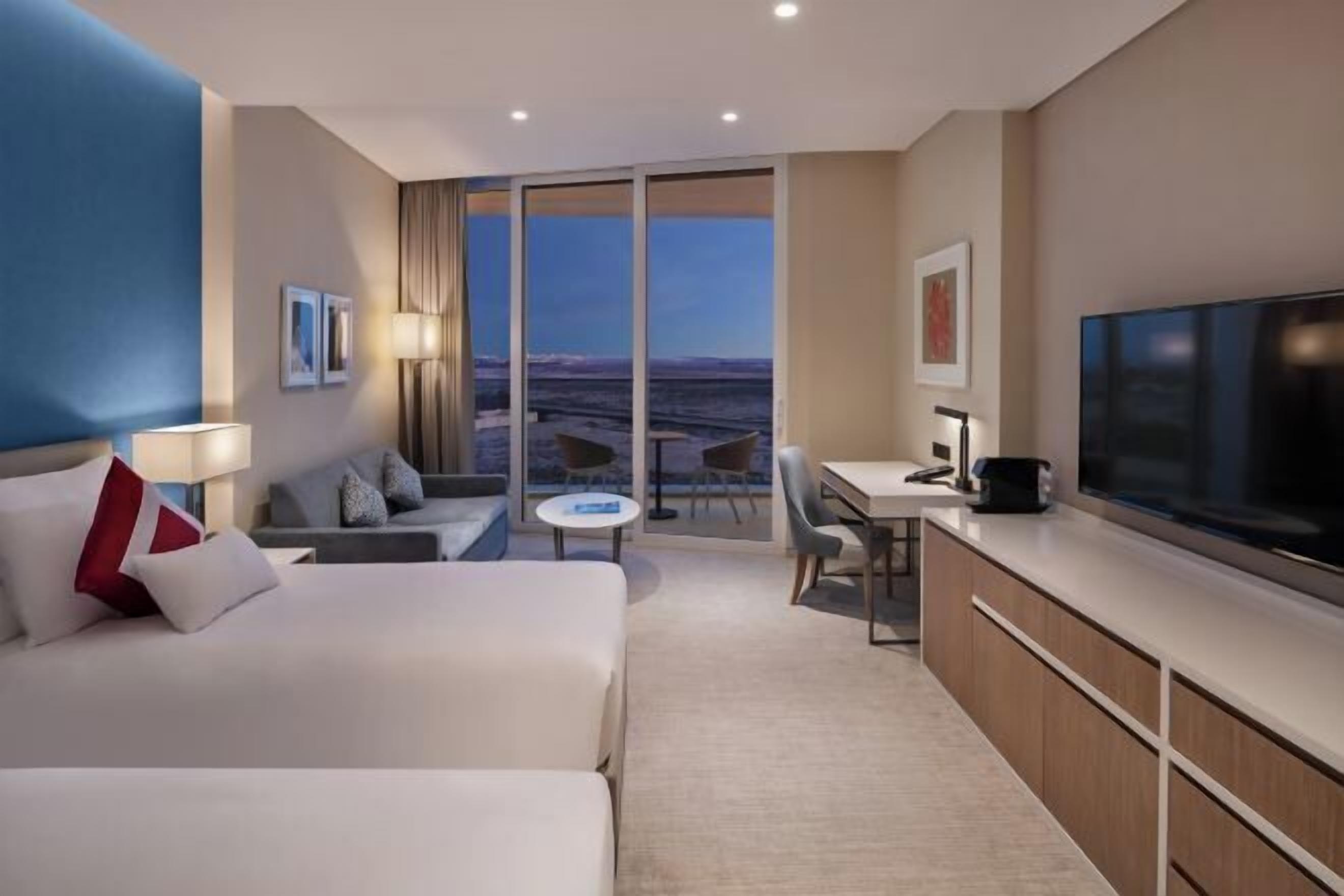 Premium bedding, down comforters, minibar, in-room safe
