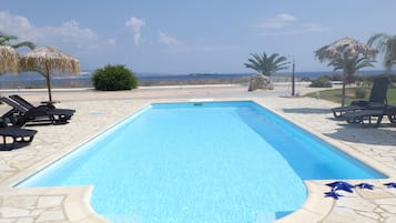 Seasonal outdoor pool, open 6:00 AM to 11:00 PM, free cabanas