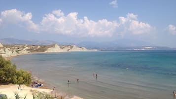 On the beach, sun loungers, beach towels, 2 beach bars