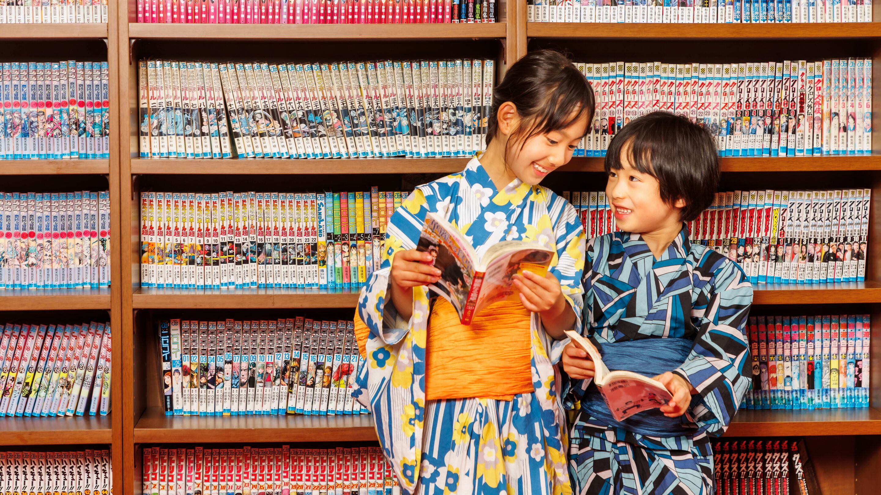 A bookshelf filled with manga volumes.