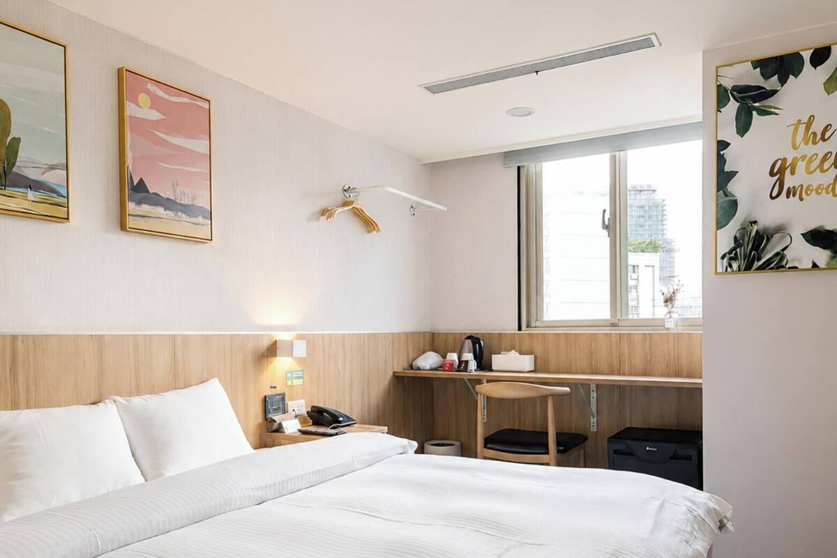 Premium bedding, down duvets, desk, laptop workspace