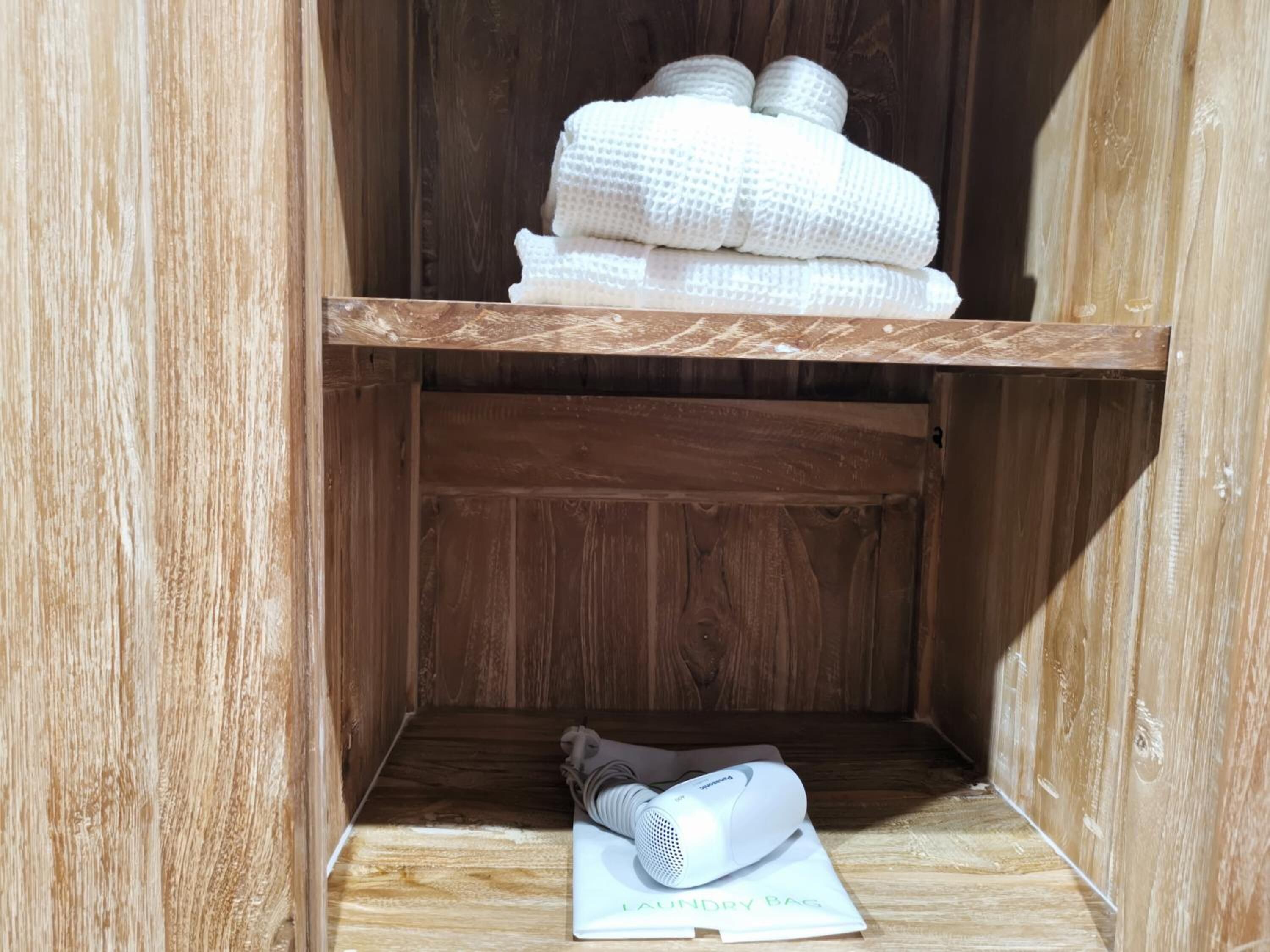 shower, hair dryer, bathrobes, slippers