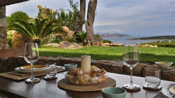 Dine al fresco with a serene view of the surrounding landscape.