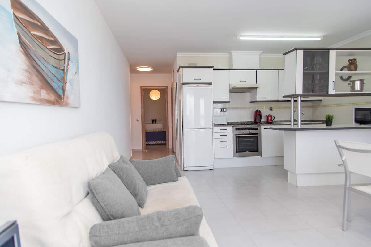 Apartment, 2 Bedrooms, Sea View | Living room | Flat-screen TV