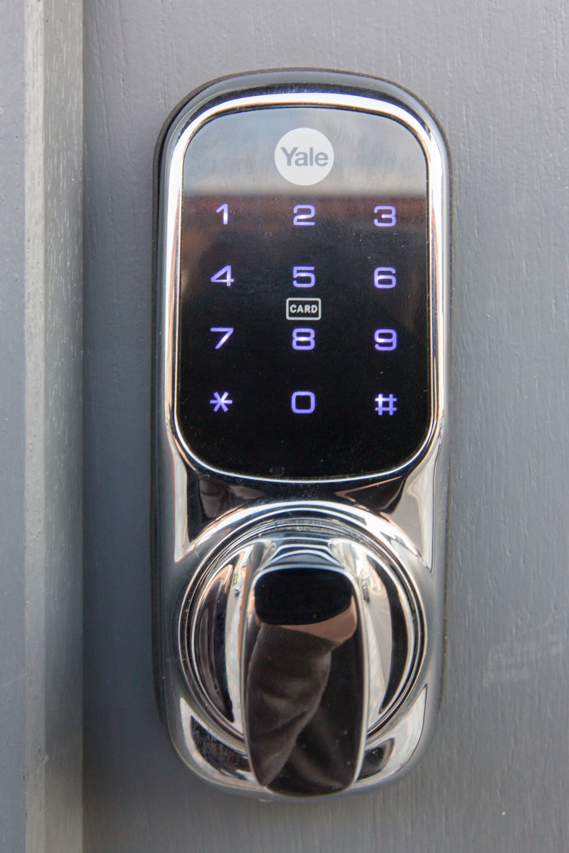 A Yale keypad lock on a door.