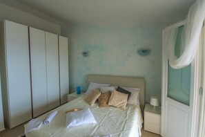 Apartamento, 2 quartos | 2 quartos, berços (sobretaxa), roupa de cama