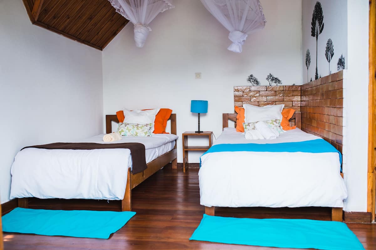 Standard Bungalow, River View | Desk, rollaway beds, bed sheets