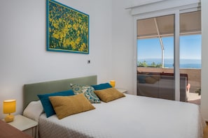 Apartment, Sea View | 3 bedrooms, in-room safe, desk, iron/ironing board