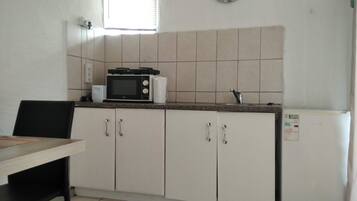 Basic Cottage, 1 Double Bed (Glad Tidings) | Private kitchen | Shared fridge, microwave, cookware/dishes/utensils