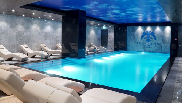 A modern indoor pool area with lounge chairs and a ceiling that simulates a sky. - The Craton Hotel (Istanbul)