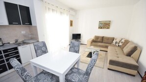 Superior Apartment, Partial Sea View | Living area | Flat-screen TV - One Bedroom Apartment Centar C9 (Budva)