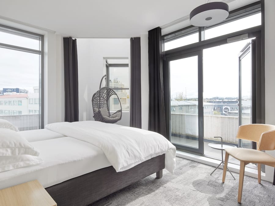 Deluxe Corner Room | Minibar, in-room safe, desk, laptop workspace