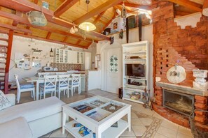 Apartment, 4 Bedrooms | Living room | TV