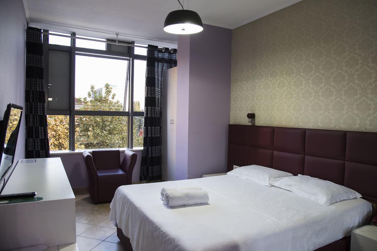 Standard Room, 1 Queen Bed, Non Smoking, City View | Premium bedding, in-room safe, desk, laptop workspace