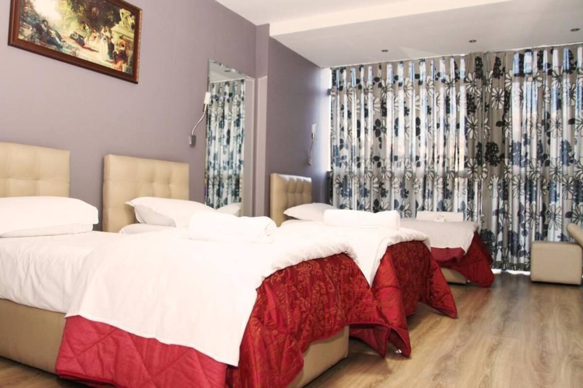 Family Room, City View | Premium bedding, in-room safe, desk, laptop workspace