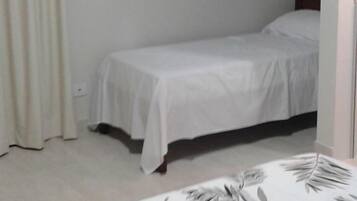 Triple Room | Minibar, blackout drapes, iron/ironing board, free WiFi