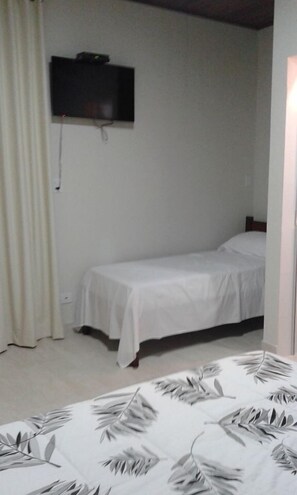 Triple Room | Minibar, blackout drapes, iron/ironing board, free WiFi
