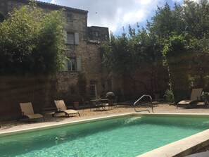 Seasonal outdoor pool, open 7:30 AM to midnight, pool umbrellas