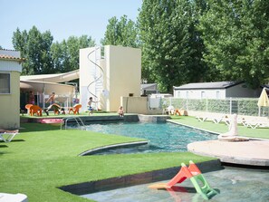 Seasonal outdoor pool, open 9:30 AM to 7:30 PM, pool umbrellas