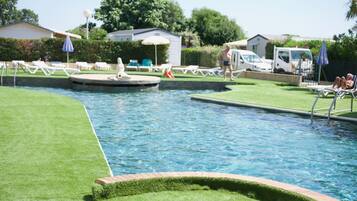 Seasonal outdoor pool, open 9:30 AM to 7:30 PM, pool umbrellas