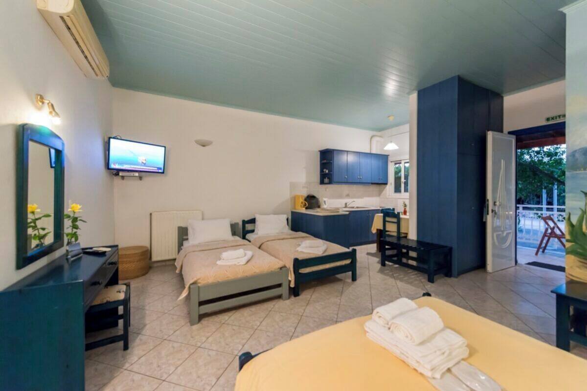 Family Apartment, Garden View | Premium bedding, minibar, in-room safe, blackout drapes