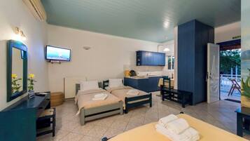 Family Apartment, Garden View | Premium bedding, minibar, in-room safe, blackout drapes