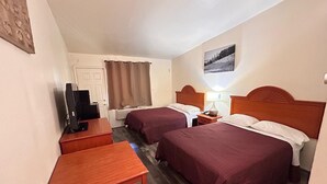 A hotel room with two beds, a desk, a television, and a window with curtains. - Carquinez Inn Vallejo I 80 Near Napa Valley (Vallejo)