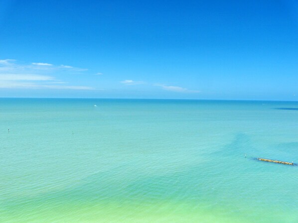 Condo, Multiple Beds (Luxurious beachfront condo in the gra) | Beach | Beach umbrellas