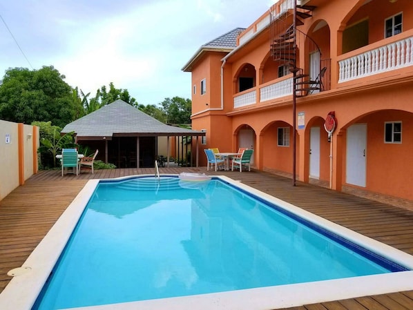 Outdoor pool, pool umbrellas, pool loungers