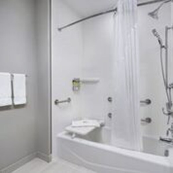 A modern bathroom with a glass-enclosed shower, a white bathtub, and a towel rack on the wall. - Holiday Inn Express & Suites Odessa I-20 by IHG (Odessa)