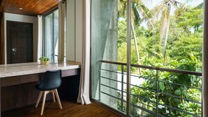 A modern kitchen with a large window overlooking a lush garden. - Chocolate Beachfront 2 BR Pool Villa (Tambon Rawai)