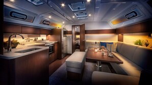 A compact, well-lit interior with a kitchenette, seating area, and skylights.