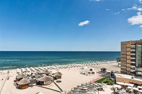 On the beach, sun-loungers, beach towels. BAVARIA Luxury Yacht
