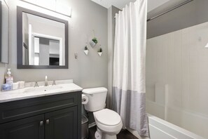 Combined shower/bathtub, hair dryer, towels, soap