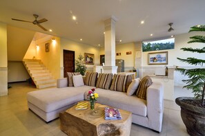 Flat-screen TV, DVD player, books, stereo