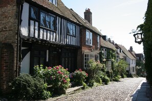 Experience the charm of a traditional European inn, with exposed beams and a classic black-framed window.