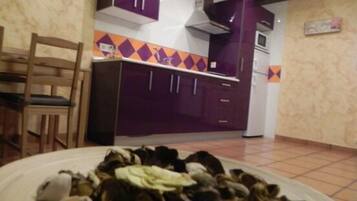 Fridge, microwave, stovetop, cookware/dishes/utensils