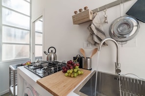 Fridge, stovetop, coffee/tea maker, cookware/dishes/utensils