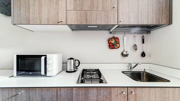 Fridge, stovetop, electric kettle, toaster