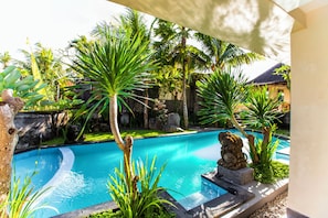 Deluxe Room, Pool View | 1 bedroom, individually decorated, individually furnished, desk