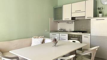 Fridge, oven, dining tables