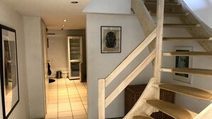 A staircase with wooden steps leading to an upper floor. - In nature, close to the city (Aabenraa)