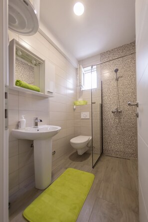 Double Room, 1 Queen Bed | Bathroom | Hair dryer, slippers, towels, toilet paper